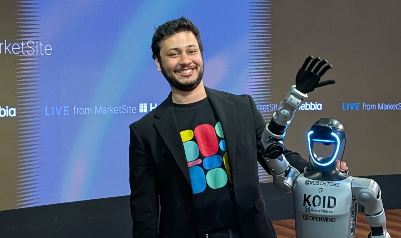 Ameya Phadke with a Unitree humanoid robot